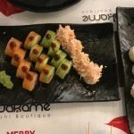 Sushi Ura Makis on 3 black plates at Wakame Lebanon