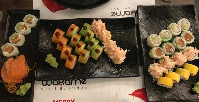 Sushi Ura Makis on 3 black plates at Wakame Lebanon