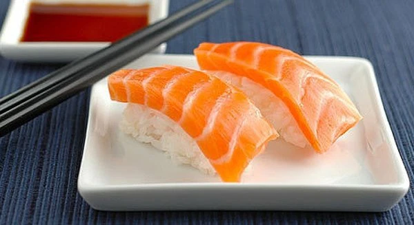 salmon nigiri, chopsticks